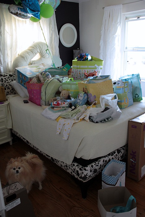 baby shower gifts on bed