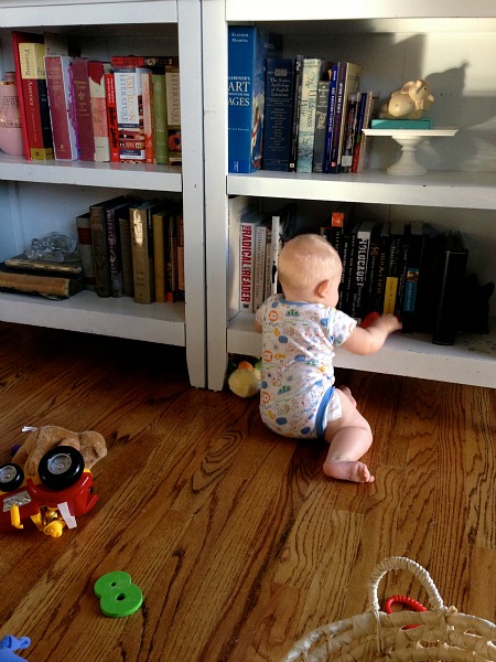 baby and bookshelves