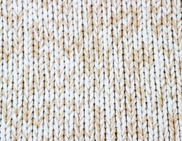 Closeup of knitted fabric, showing knit stitches